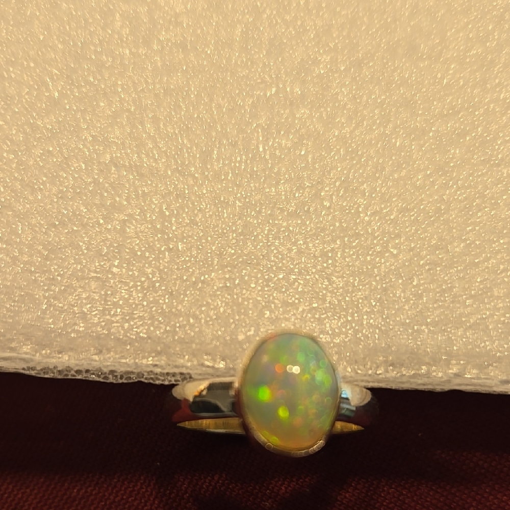 Elegant Opal Ring in Silver Setting